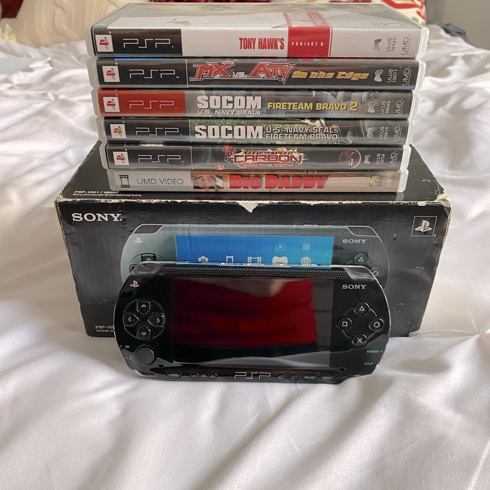 Sony PSP console with games.